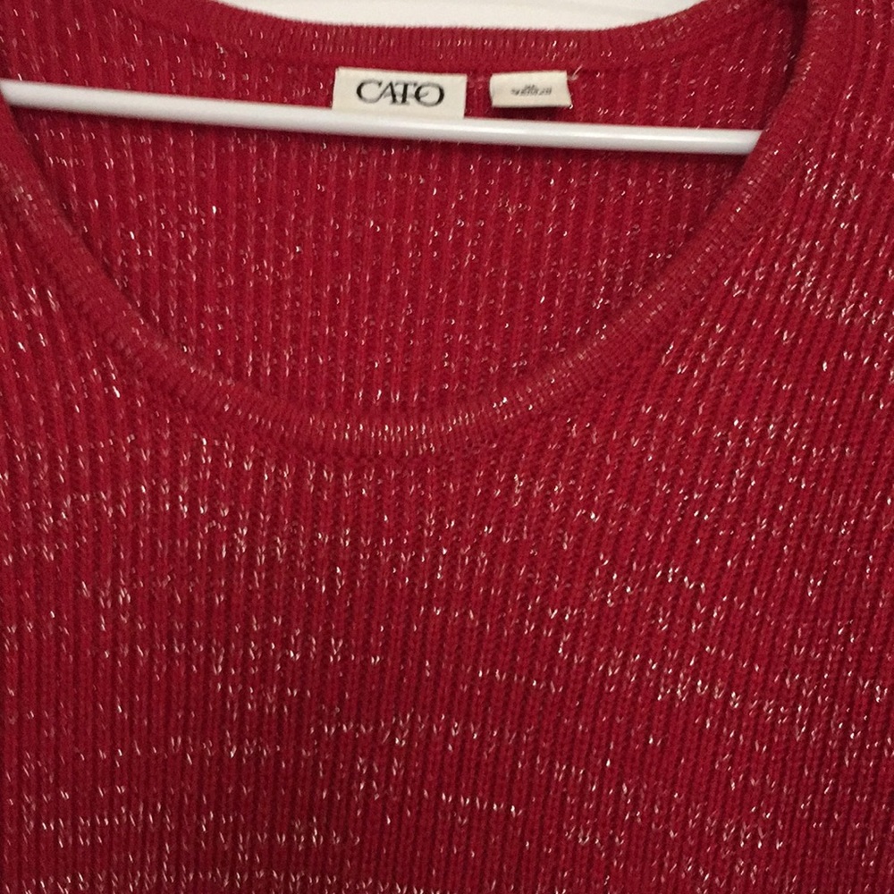 Red tunic with silver threading.